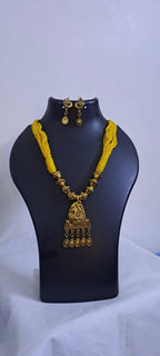 Yellow thread necklace with Golden oxidised traditional pendant
