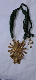 Green thread necklace with oxidised golden durga pendant