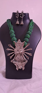 Green thread necklace with oxidised golden durga pendant