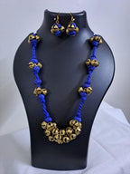 Blue thread necklace with trinkets n matching earrings