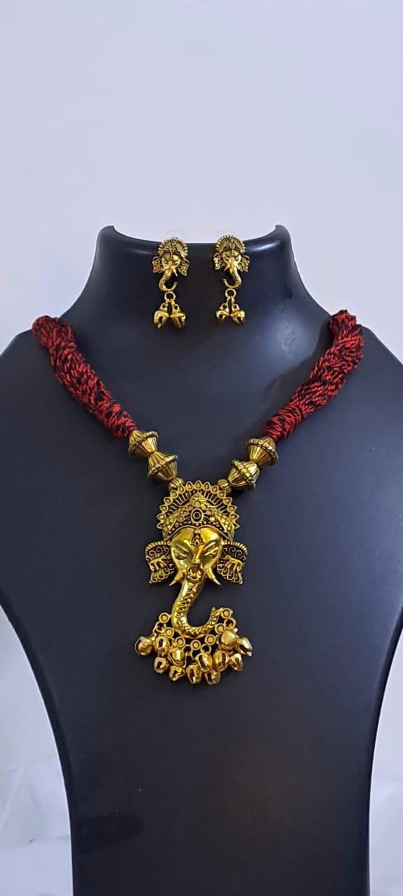 Red thread necklace with Golden oxidised traditional pendant