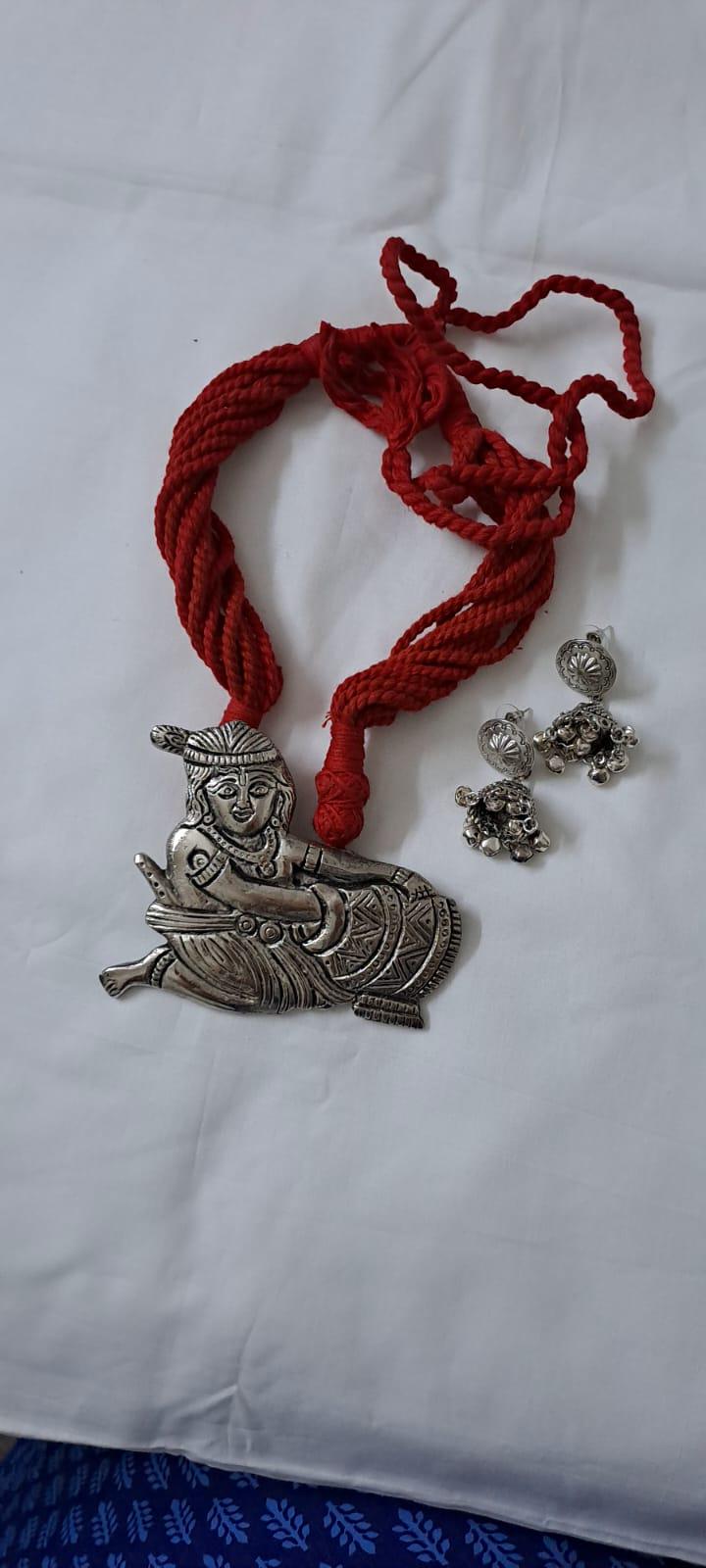 Red thread necklace with silver oxidised krishna pendant
