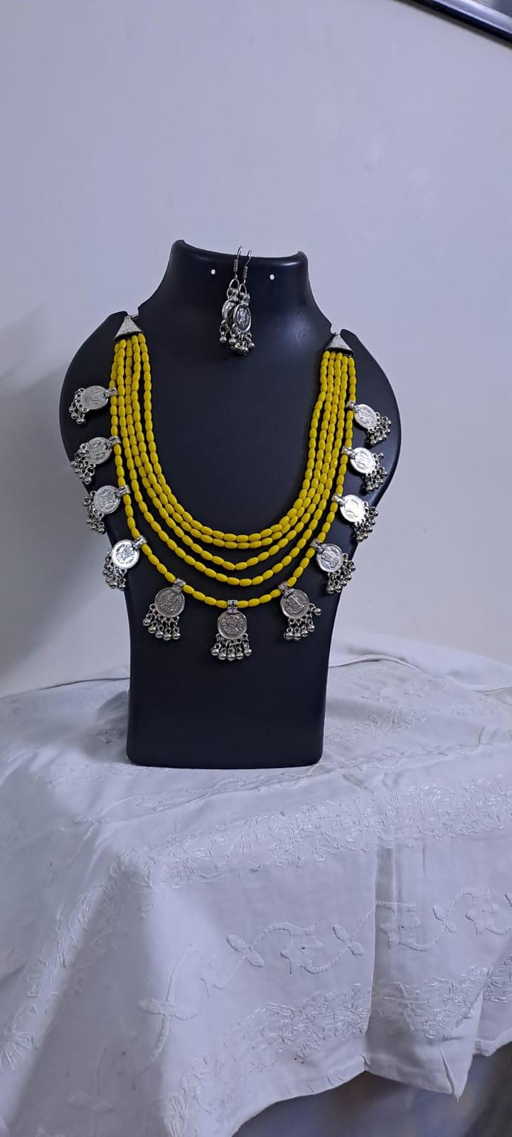 Exclusive multi layered  yellow glass beads necklace set with silver oxidised charms n matching earrings