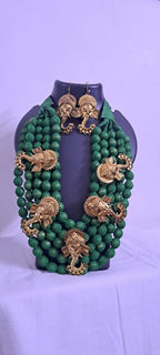 Multilayered fabric beads set with golden oxidised goddess Durga pendants - Dark Green
