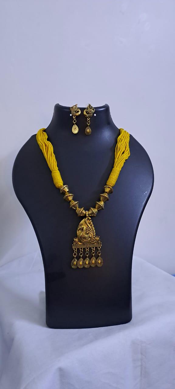 Yellow thread necklace with Golden oxidised traditional pendant
