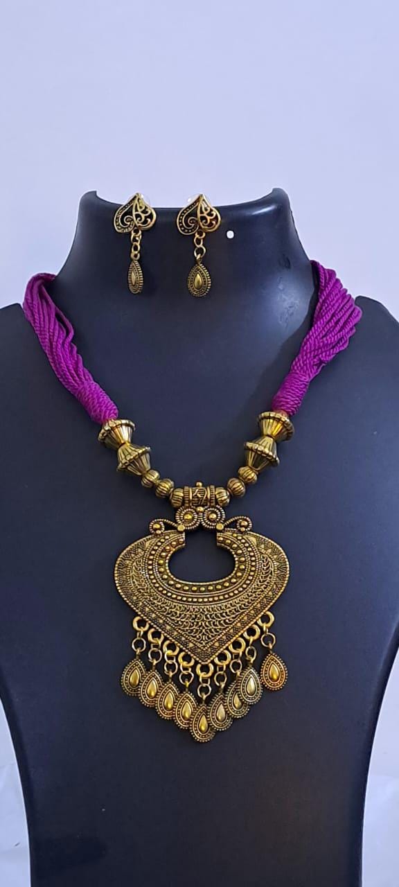 Purple thread necklace with Golden oxidised traditional pendant