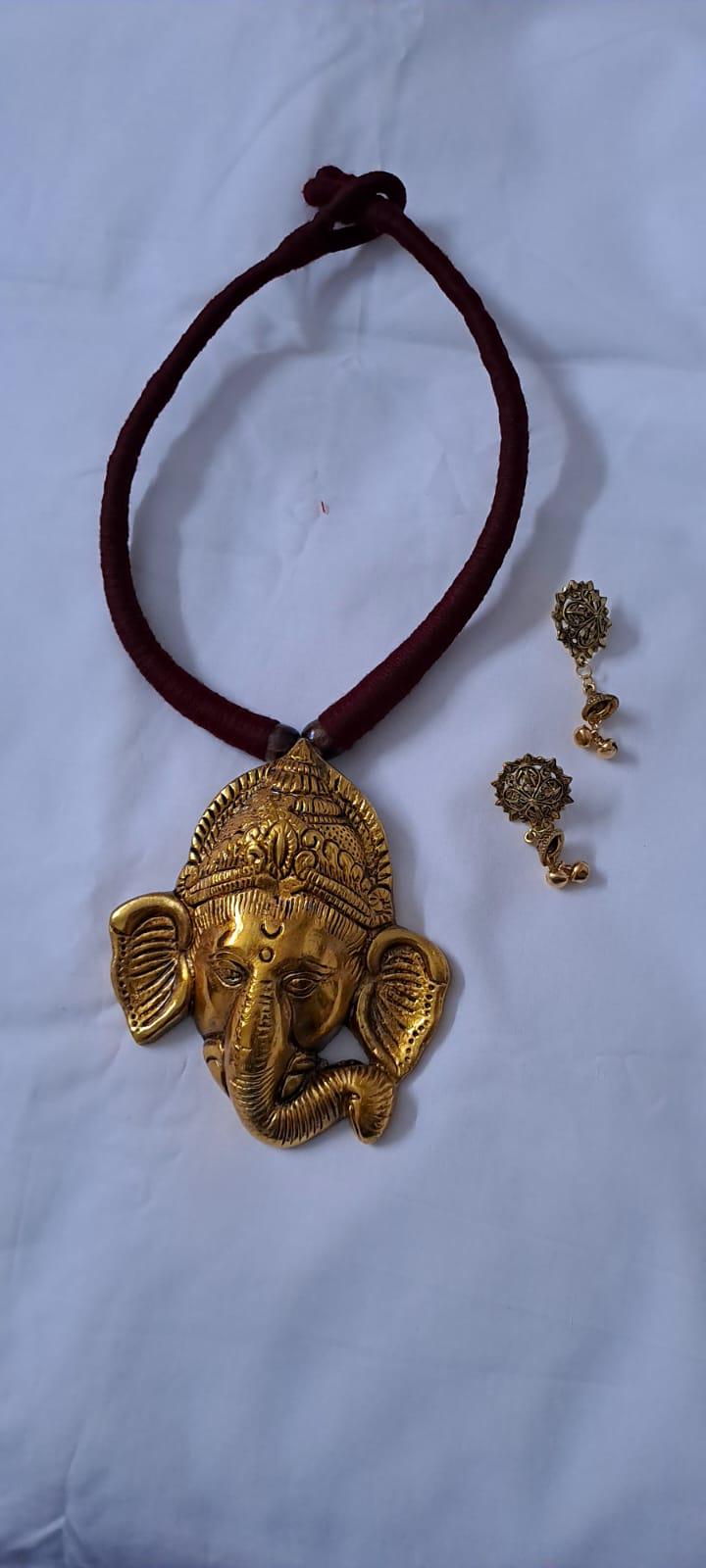 Maroon thread necklace with golden oxidised ganesha pendant