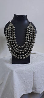 Multi-layered silver oxidised beads necklace .