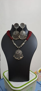 Maroon thread necklace with silver oxidised traditional pendant