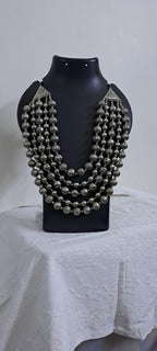 Multi-layered silver oxidised beads necklace .