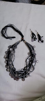 Exclusive multi-coloured and multi-layered thread necklace with silver oxidised charms