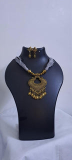 Grey thread necklace with Golden oxidised traditional pendant