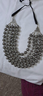 Multi-layered silver oxidised beads necklace .