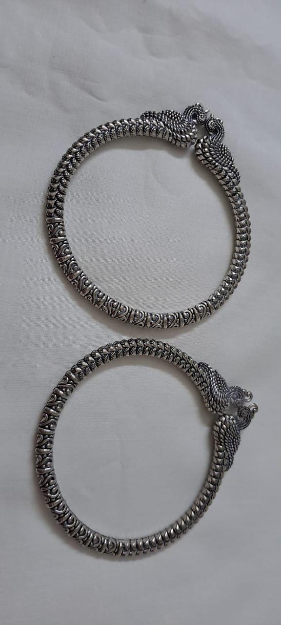 Traditional silver oxidised bangles with peacock