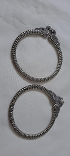 Traditional silver oxidised bangles with peacock
