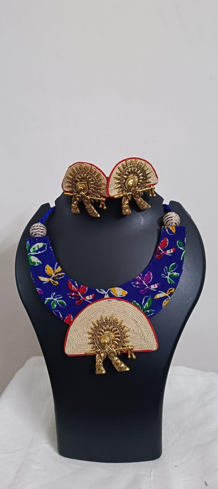 Unique fabric n thread necklace set with golden oxidised pendant and matching earrings