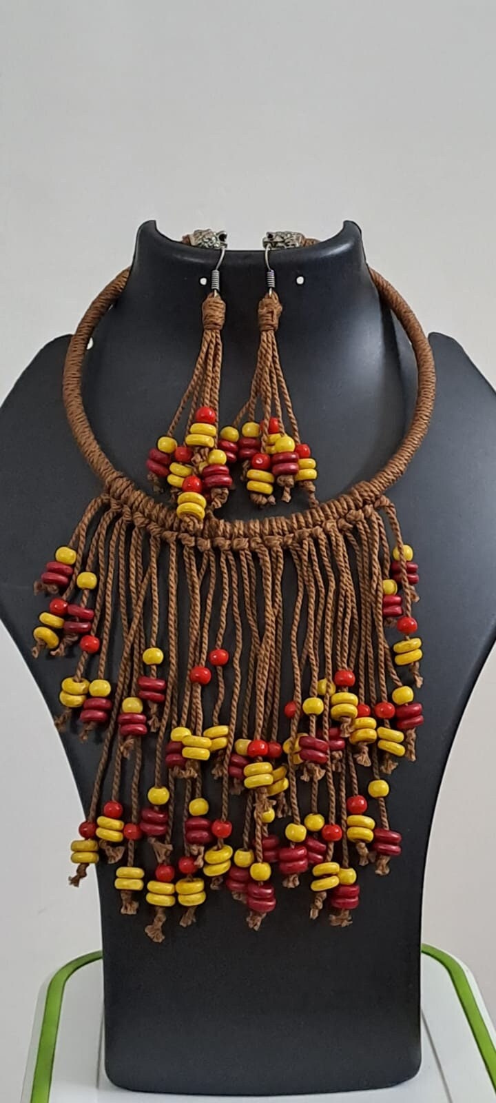 Exclusive brown thread neckband with fringes and matching earrings.