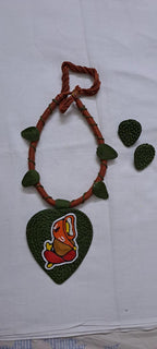 Exclusive forest green and brown thread necklace with leaf shaped  Ganesha thread pendant and matching earrings.