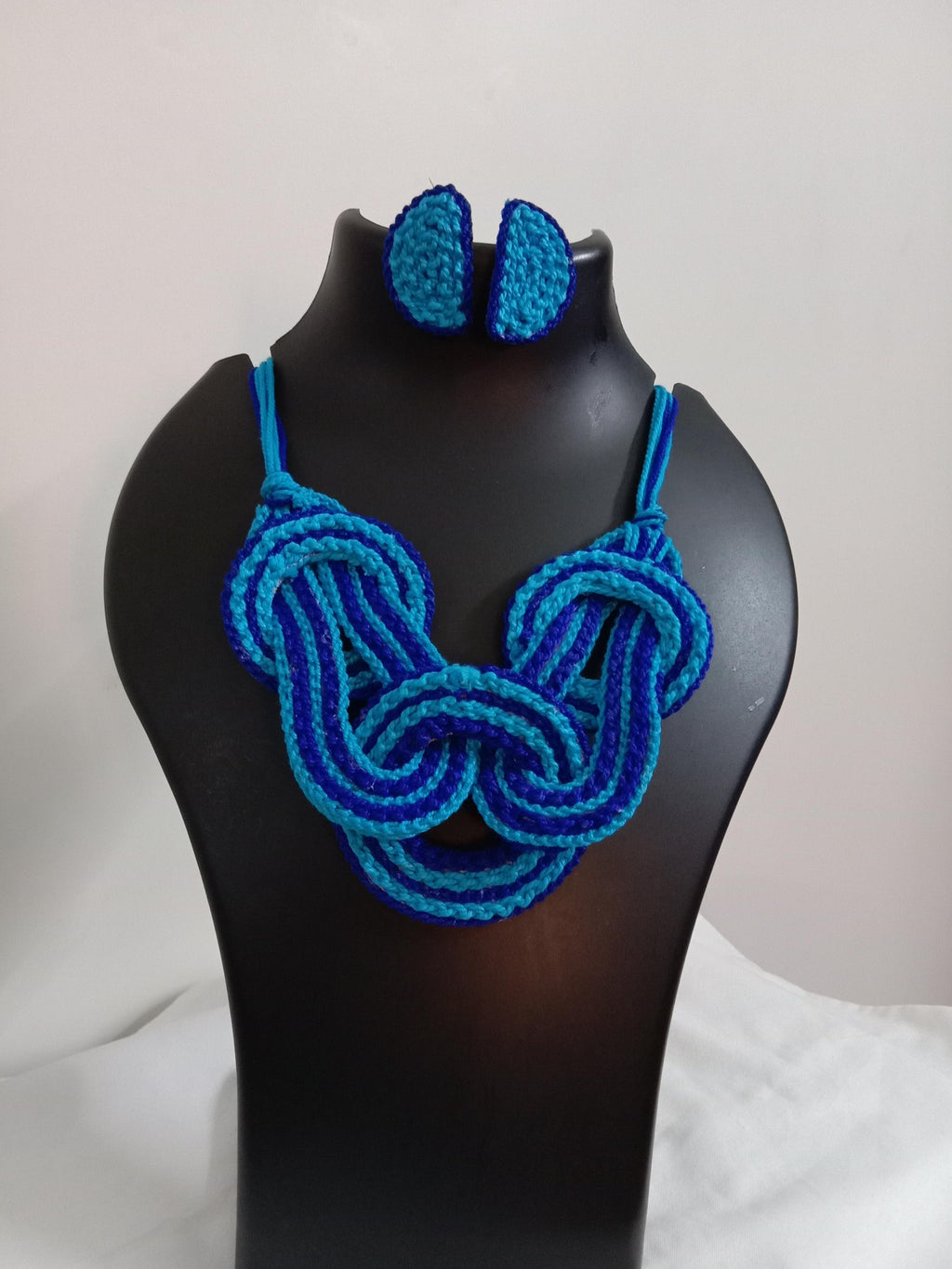 Celtic knot thread necklace with matching thread earrings.