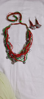 Exclusive multi-coloured and multi-layered thread necklace with silver oxidised charms