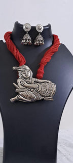 Red thread necklace with silver oxidised krishna pendant