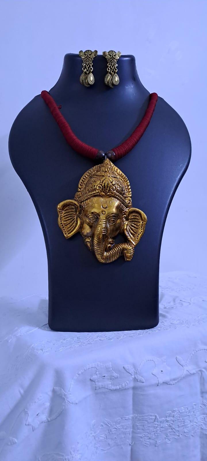Maroon thread necklace with golden oxidised ganesha pendant