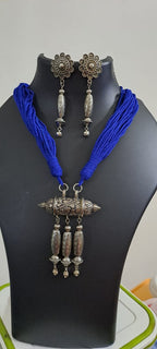 Blue thread necklace with silver oxidised traditional pendant