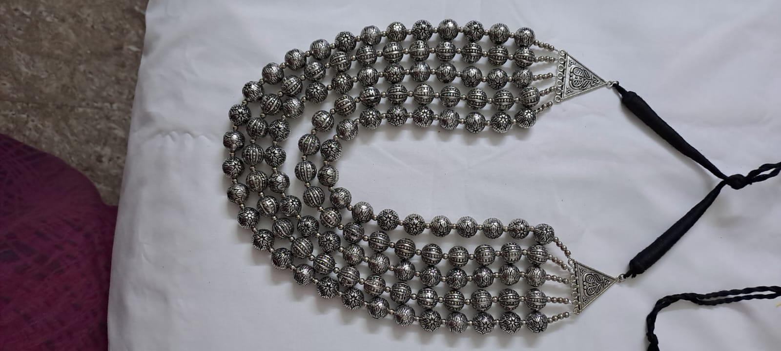 Multi-layered silver oxidised beads necklace .