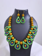 Green n yellow thread necklace with matching thread earrings.