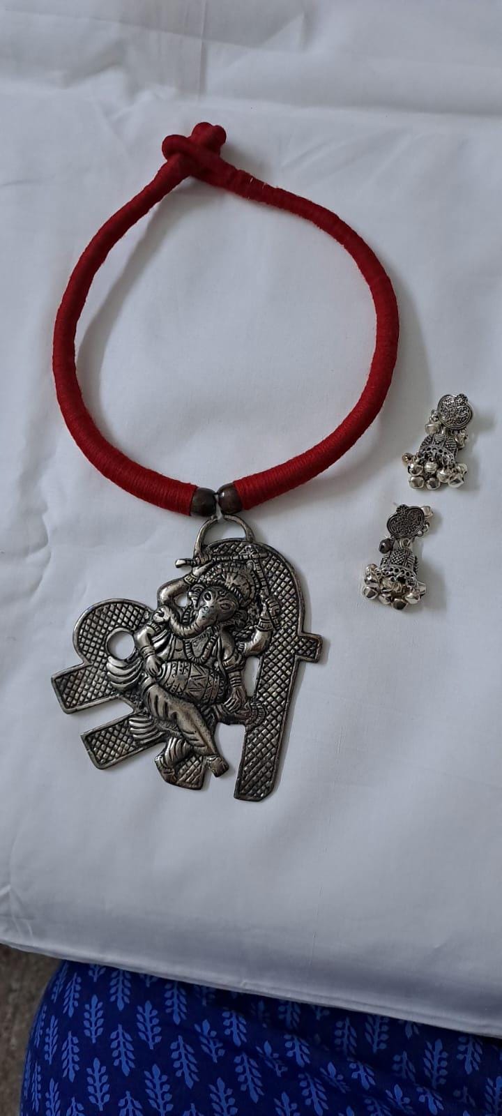 Red thread necklace with silver oxidised ganesha pendant