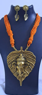 Orange thread necklace with golden oxidised ganesha pendant