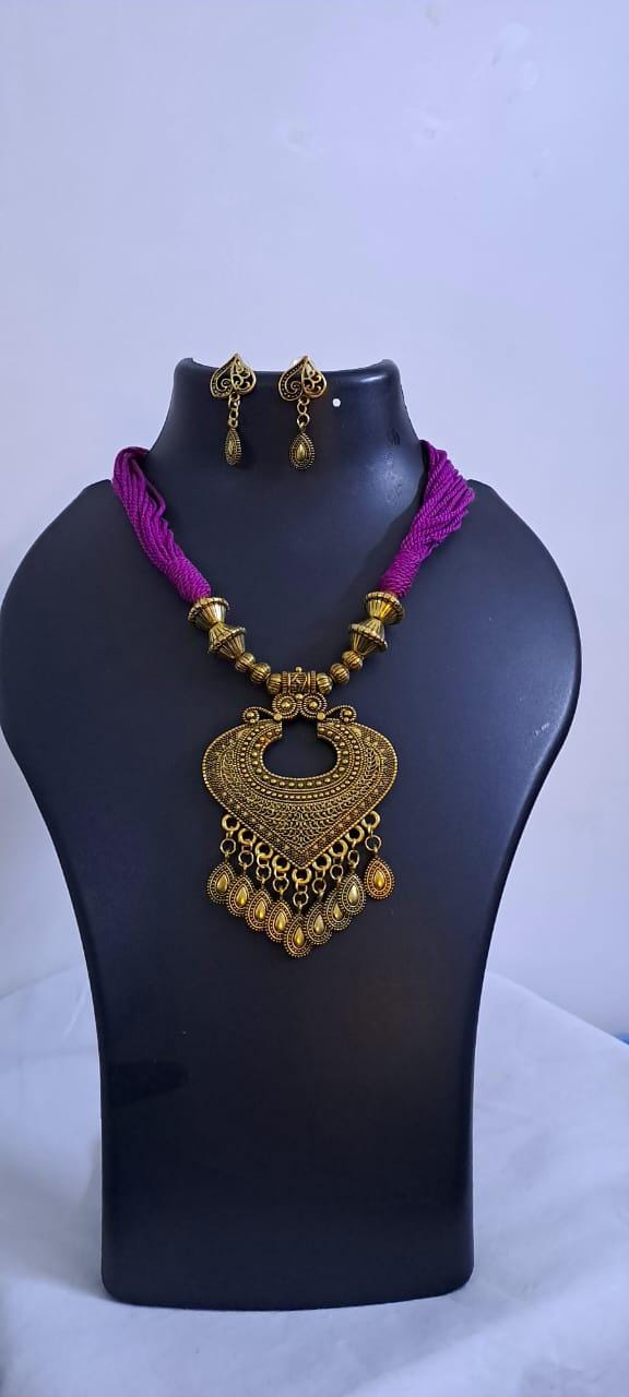 Purple thread necklace with Golden oxidised traditional pendant
