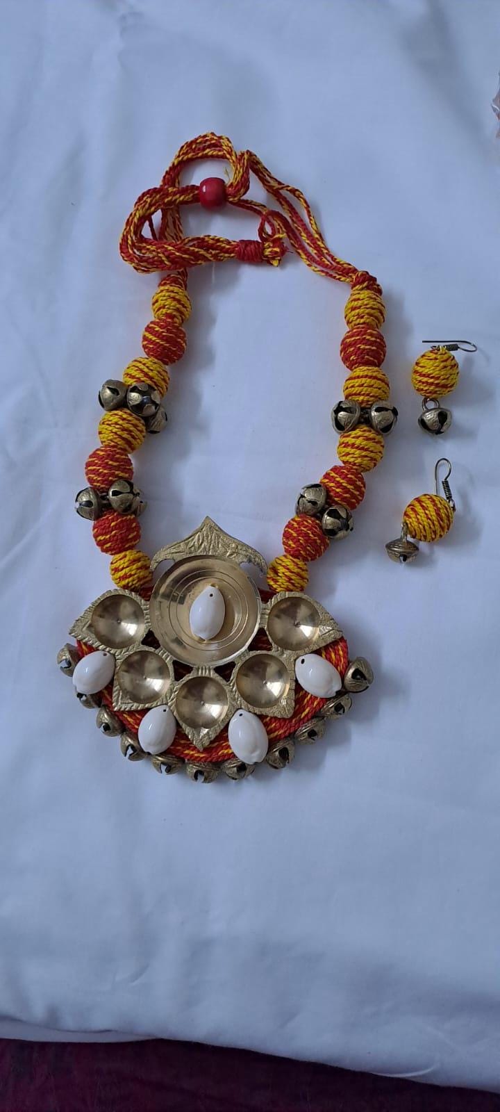 Red yellow thread beads necklace set with dokra pendant n matching earrings