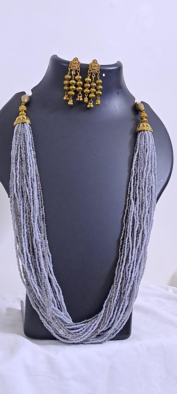 Exclusive multi layered  grey glass beads necklace set with golden oxidised matching earrings