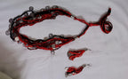 Exclusive multi-coloured and multi-layered thread necklace with silver oxidised charms