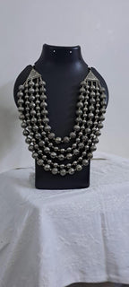 Multi-layered silver oxidised beads necklace .