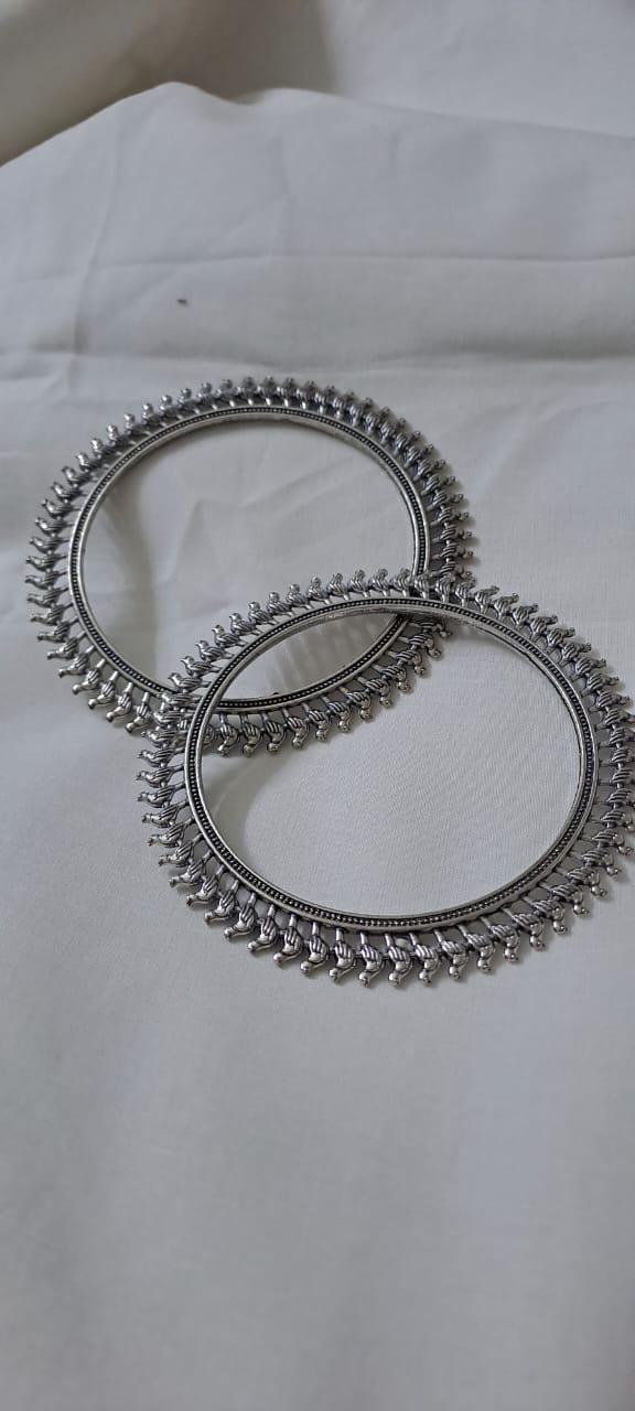 Traditional silver oxidised bangles with birds border.
