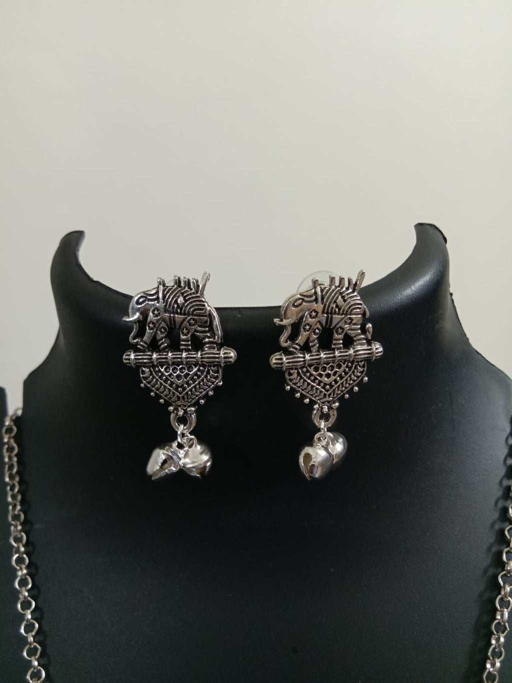 Oxidised silver chain with traditional pendant and matching earrings.