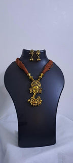 Brown thread necklace with Golden oxidised traditional pendant