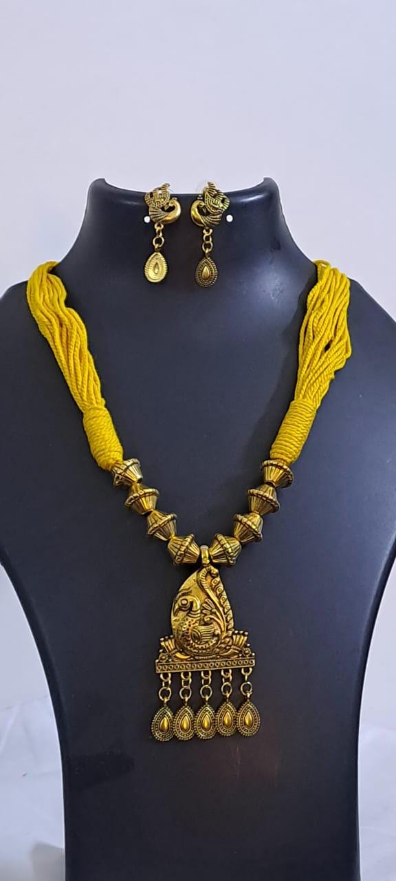 Yellow thread necklace with Golden oxidised traditional pendant