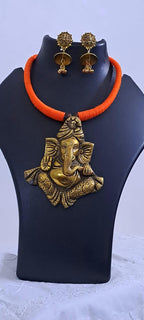 Orange thread necklace with golden oxidised ganesha pendant