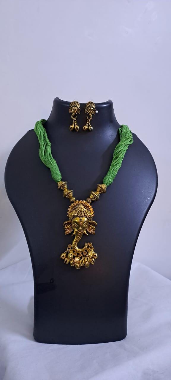 Green thread necklace with Golden oxidised traditional pendant