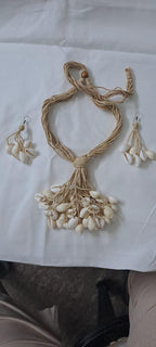 Multi layered jute necklace with shell fringes and with matching earrings.