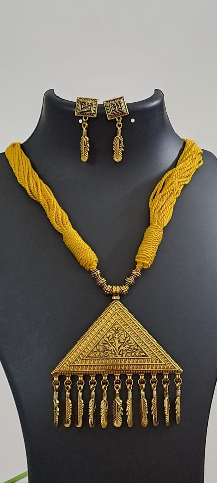 Yellow thread necklace with Golden oxidised traditional pendant