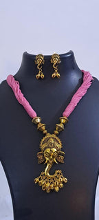 Pink thread necklace with Golden oxidised traditional pendant