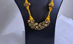 Yellow thread necklace with trinkets n matching earrings