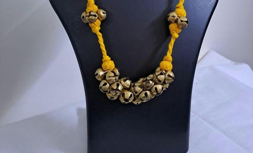Yellow thread necklace with trinkets n matching earrings
