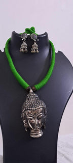 Green thread necklace with silver oxidised buddha pendant