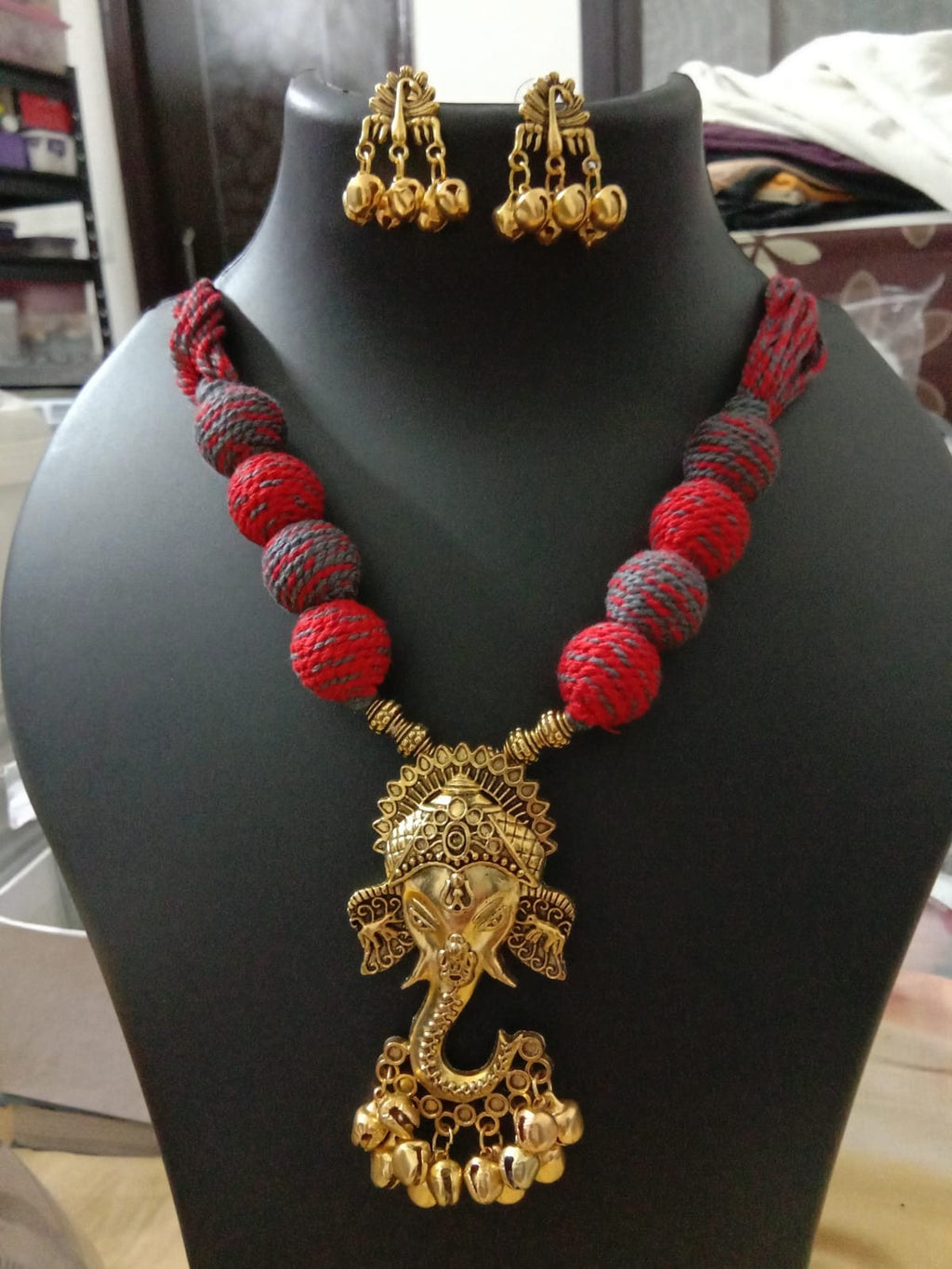 Oxidised golden ganesha traditional pendant and matching earrings.