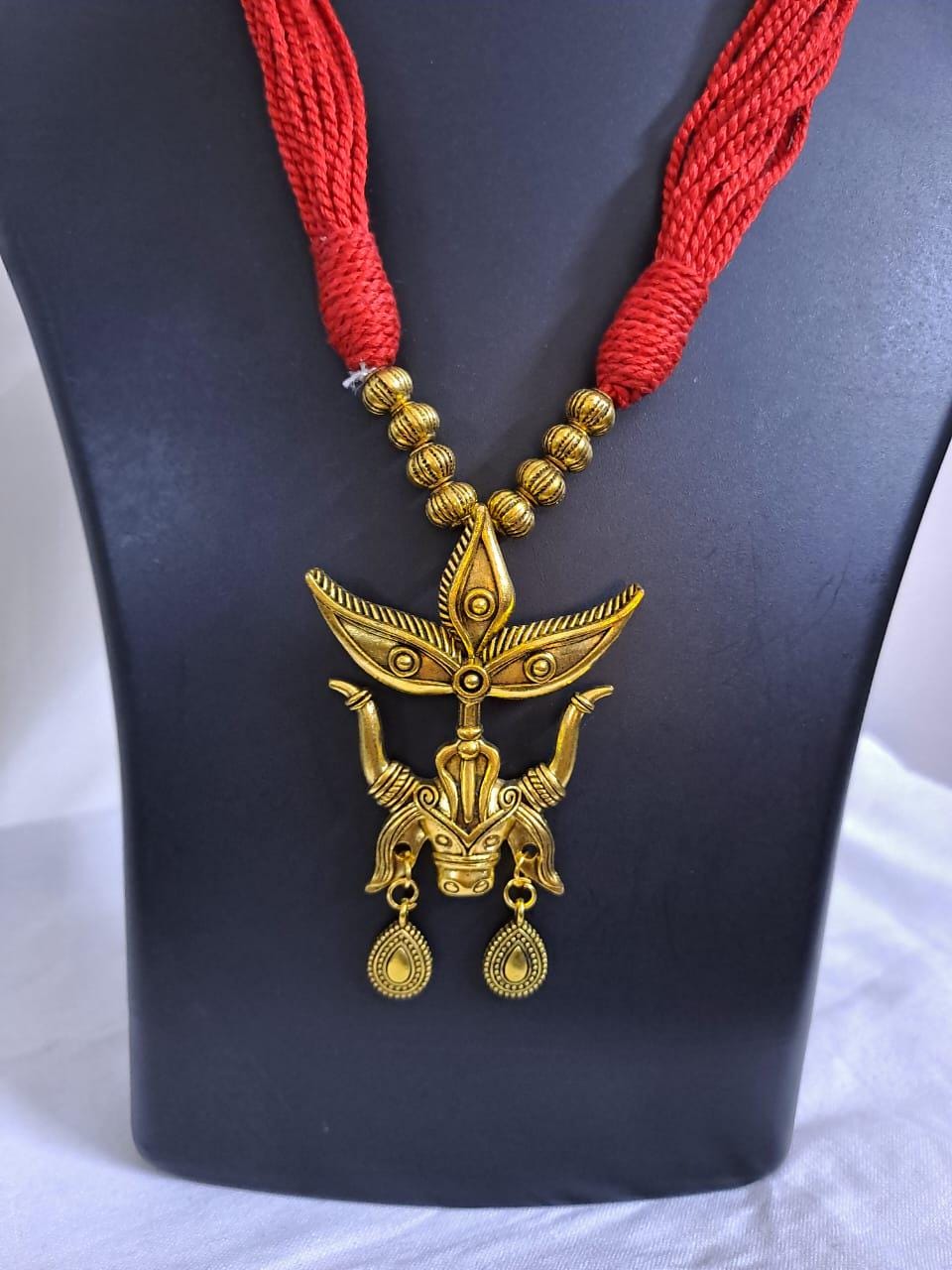 Red thread necklace with golden oxidised Durga pendant n matching earrings